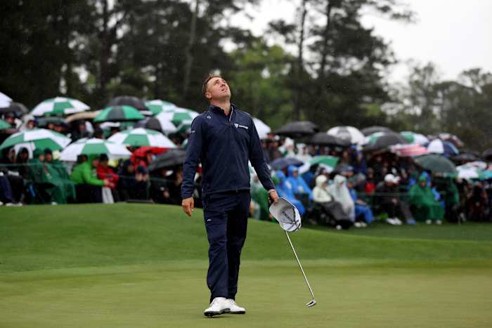 Justin Thomas of the United States reacts to his bogey on the 18th green during the continuation of the weather delayed second round of the 2023 Masters Tournament at Augusta National Golf Club on April 08, 2023 in Augusta, Georgia.